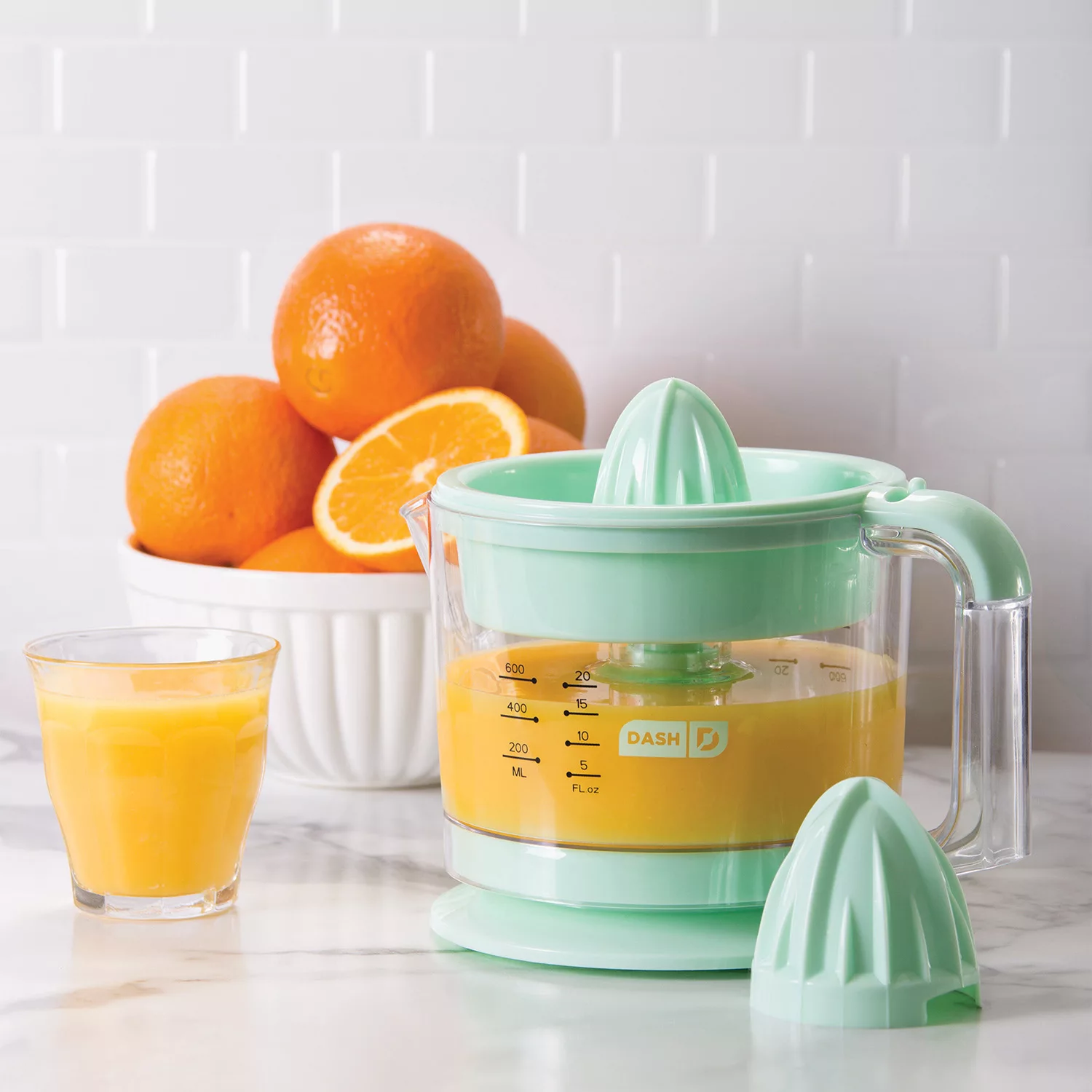 Dash Citrus Juicer Extractor: Compact Juicer for Healthy Juice, Oranges, Lemons, Limes, Grapefruit & other Citrus Fruit with Easy Pour Spout + 32 oz Pitcher – Aqua